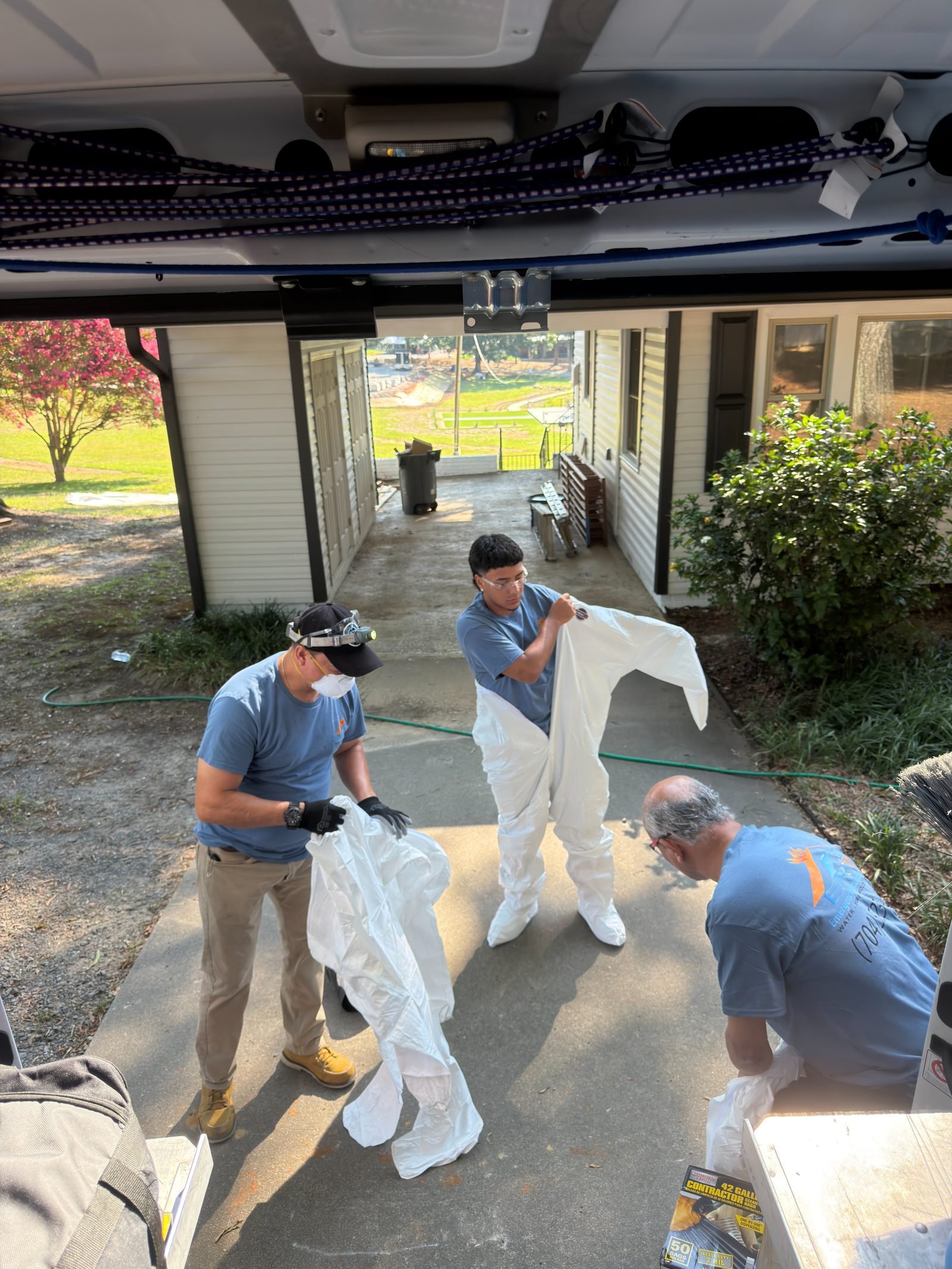 Emergency Restoration Team crew suiting up in PPE before a mold remediation job in Charlotte NC