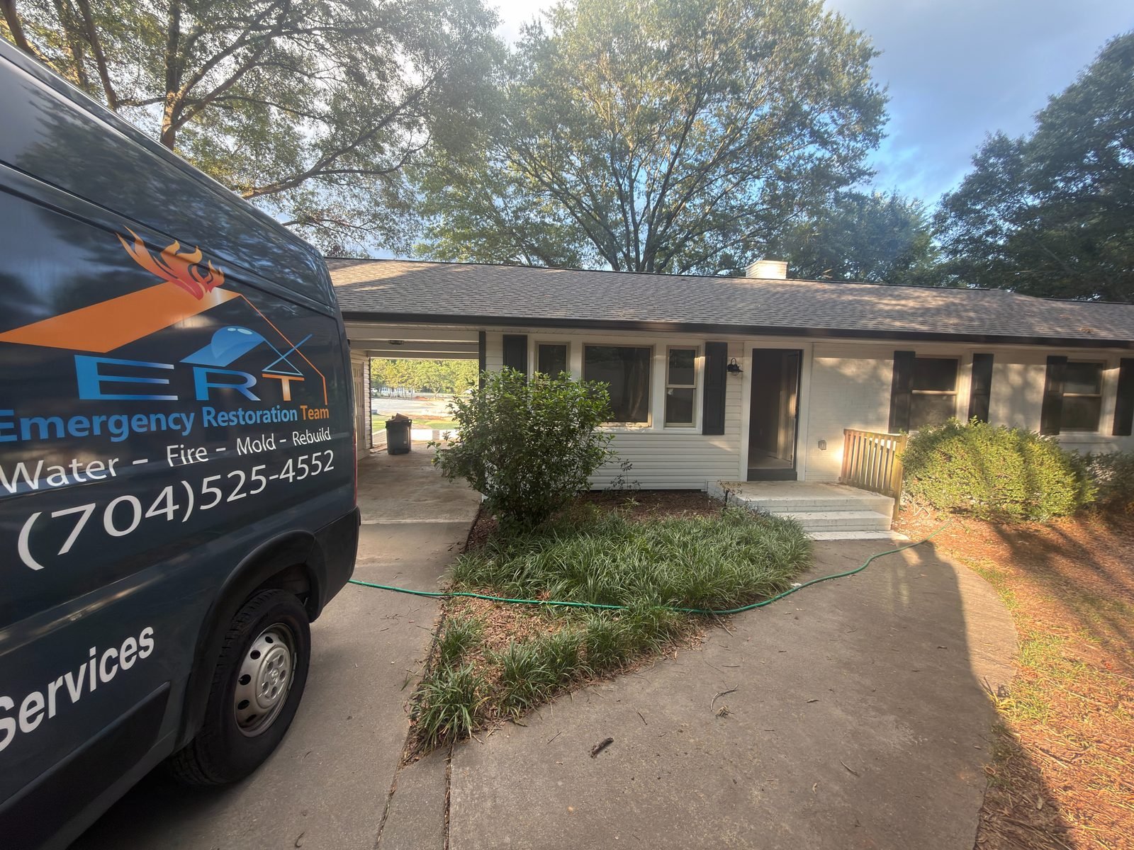 Emergency Restoration Team branded van on site at a Charlotte NC home